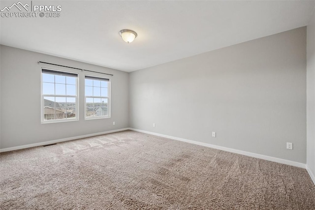 7318 Dutch Loop, Colorado Springs, CO 80925 - carpeted spare room with baseboards and visible vents