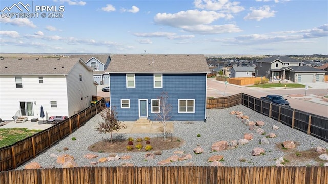 7318 Dutch Loop, Colorado Springs, CO 80925 - back of property with a residential view, a fenced backyard, and entry steps