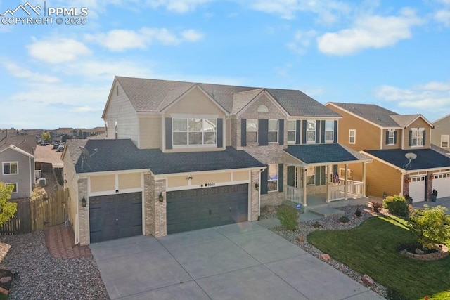 9089 Royal Melbourne Cir, Peyton, CO 80831 - traditional-style house featuring an attached garage, fence, driveway, and a residential view