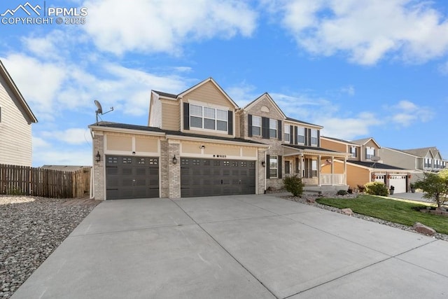 9089 Royal Melbourne Cir, Peyton, CO 80831 - view of front of property with fence, brick siding, concrete driveway, an attached garage, and a residential view