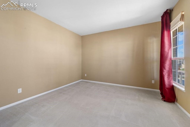 9089 Royal Melbourne Cir, Peyton, CO 80831 - unfurnished room featuring baseboards and light colored carpet