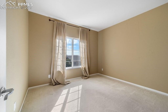 9089 Royal Melbourne Cir, Peyton, CO 80831 - spare room with baseboards and light colored carpet