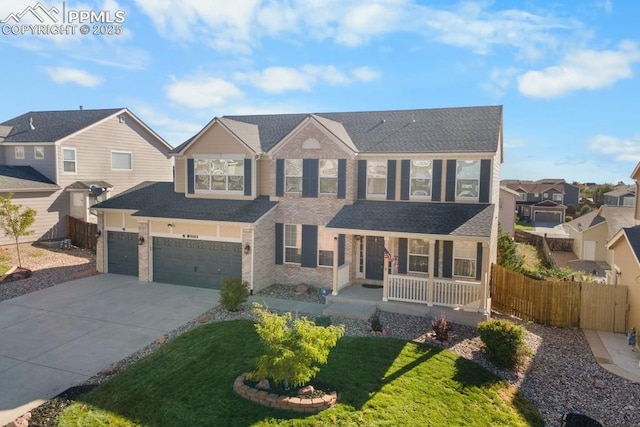9089 Royal Melbourne Cir, Peyton, CO 80831 - traditional home featuring a porch, driveway, a residential view, fence, and a shingled roof
