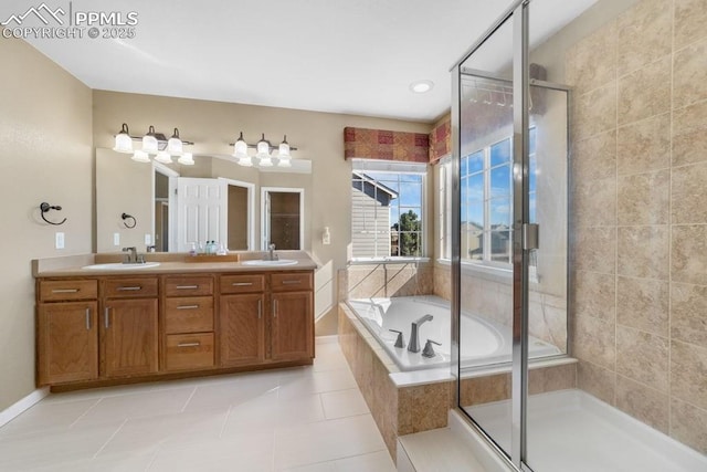 9089 Royal Melbourne Cir, Peyton, CO 80831 - bathroom featuring a sink, tile patterned flooring, a stall shower, and a garden tub