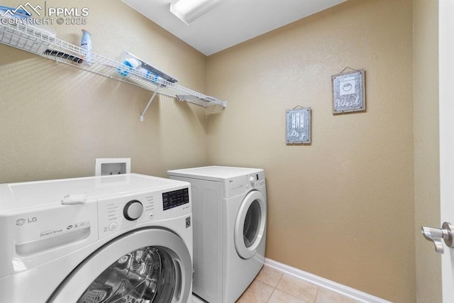 9089 Royal Melbourne Cir, Peyton, CO 80831 - washroom with washer and dryer, laundry area, baseboards, and light tile patterned floors