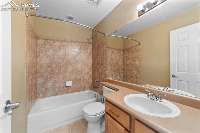 9089 Royal Melbourne Cir, Peyton, CO 80831 - bathroom featuring visible vents, tile patterned flooring, vanity, toilet, and tub / shower combination