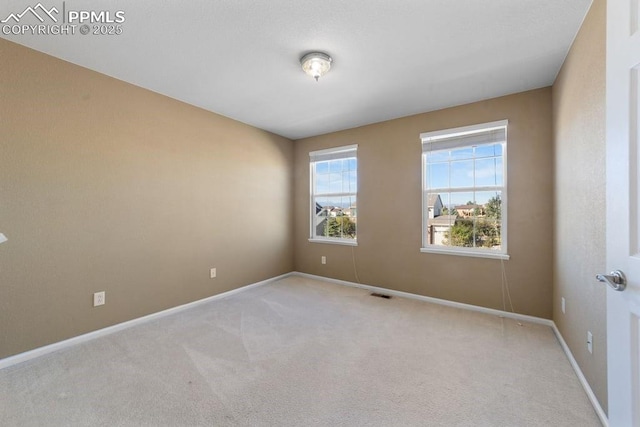 9089 Royal Melbourne Cir, Peyton, CO 80831 - unfurnished room with baseboards, carpet, and visible vents