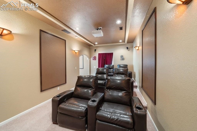 9089 Royal Melbourne Cir, Peyton, CO 80831 - home theater with visible vents, arched walkways, carpet floors, baseboards, and recessed lighting