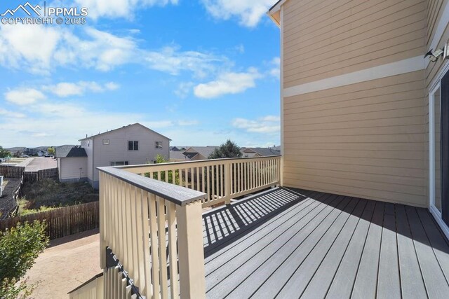 9089 Royal Melbourne Cir, Peyton, CO 80831 - wooden terrace with fence and a residential view