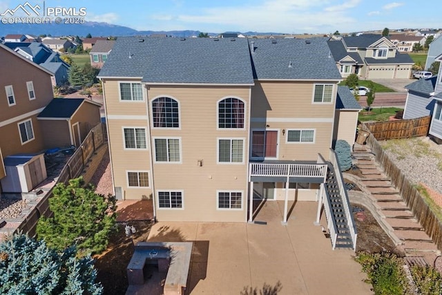 9089 Royal Melbourne Cir, Peyton, CO 80831 - view of building exterior featuring fence, a residential view, and stairs