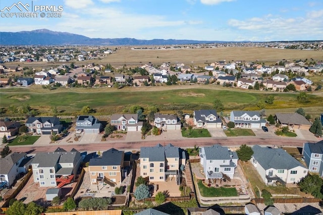 9089 Royal Melbourne Cir, Peyton, CO 80831 - aerial view with a residential view, a mountain view, and golf course view