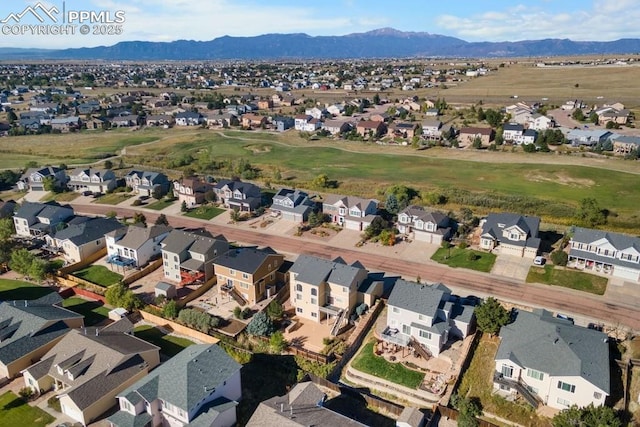 9089 Royal Melbourne Cir, Peyton, CO 80831 - aerial view featuring a mountain view, golf course view, and a residential view
