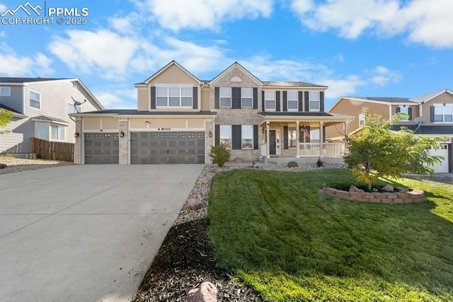 9089 Royal Melbourne Cir, Peyton, CO 80831 - traditional home featuring covered porch, driveway, a front yard, brick siding, and an attached garage