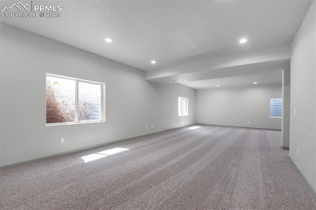 interior space with baseboards and recessed lighting