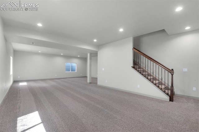 below grade area featuring carpet floors, recessed lighting, stairs, and baseboards