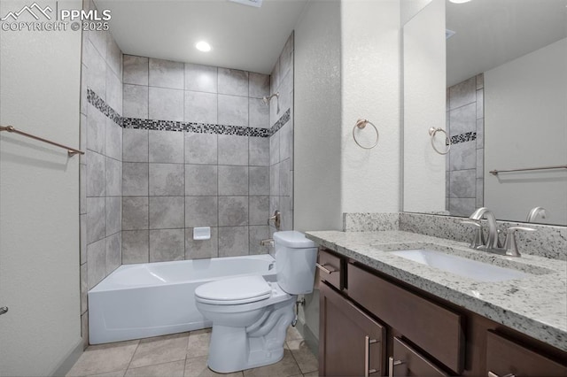 bathroom with baseboards, vanity, toilet, and  shower combination