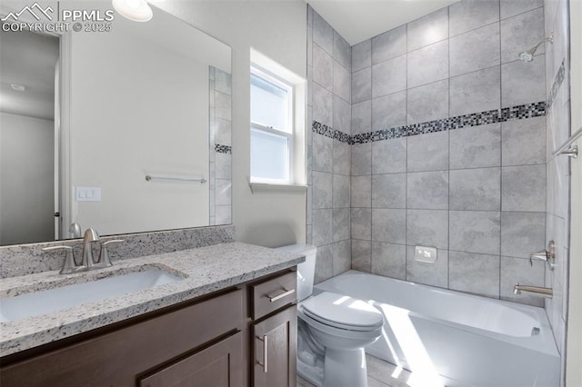 bathroom featuring vanity, toilet, and tub / shower combination