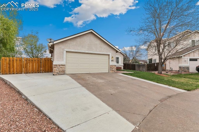view of side of home featuring stone siding, stucco siding, and a garage