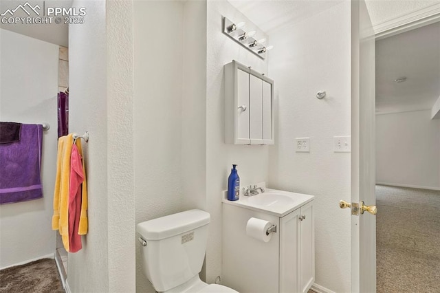 bathroom with toilet and vanity