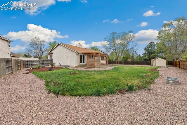 rear view of house with a shed, a patio, and an outdoor structure