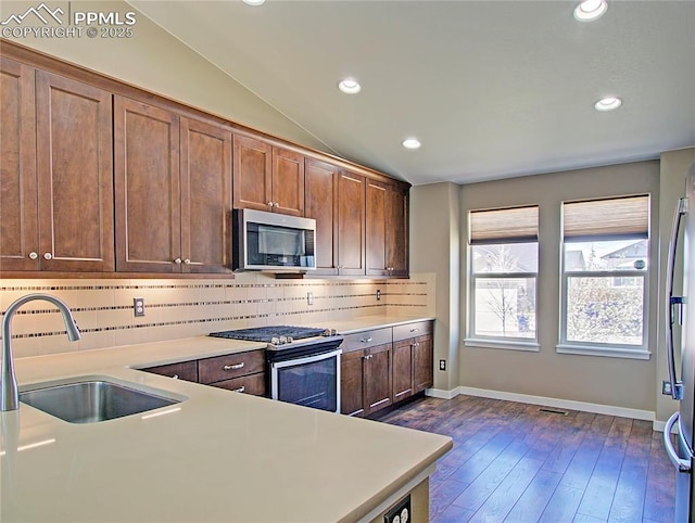 6996 Mustang Rim Dr, Colorado Springs, CO 80923 - kitchen featuring tasteful backsplash, a sink, light countertops, stainless steel appliances, and recessed lighting