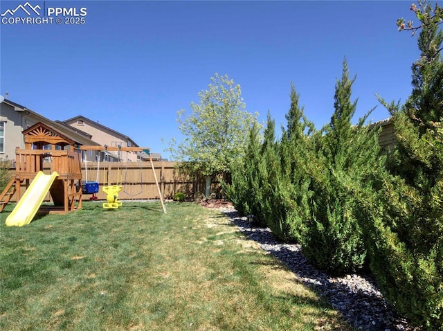 6996 Mustang Rim Dr, Colorado Springs, CO 80923 - view of yard featuring a fenced backyard and a playground