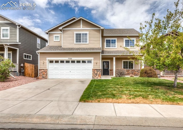 craftsman house featuring an attached garage, fence, a front yard, and stone siding