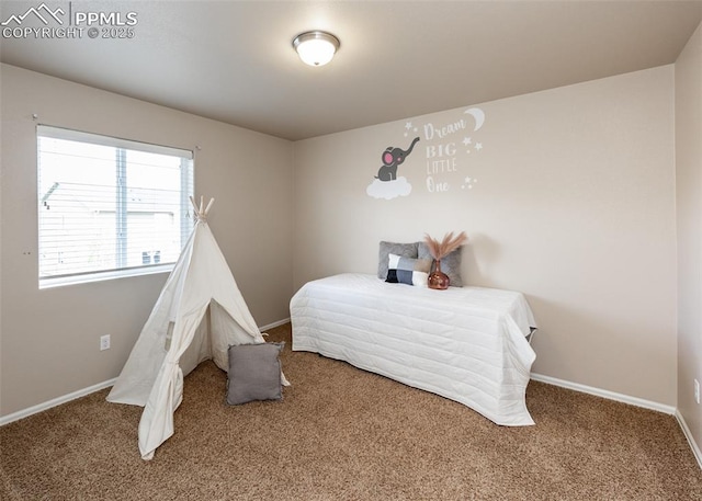carpeted bedroom featuring baseboards