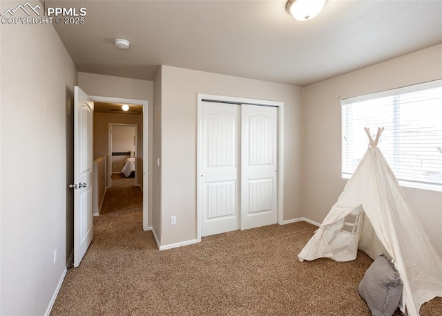 game room featuring baseboards and carpet