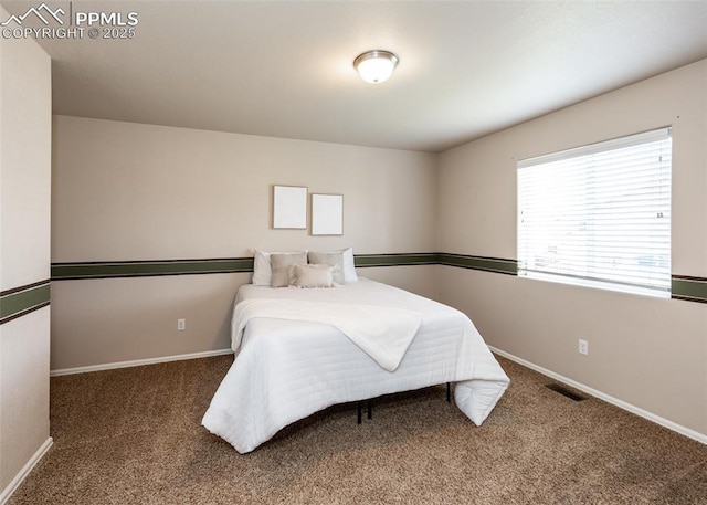 bedroom featuring visible vents, baseboards, and carpet floors