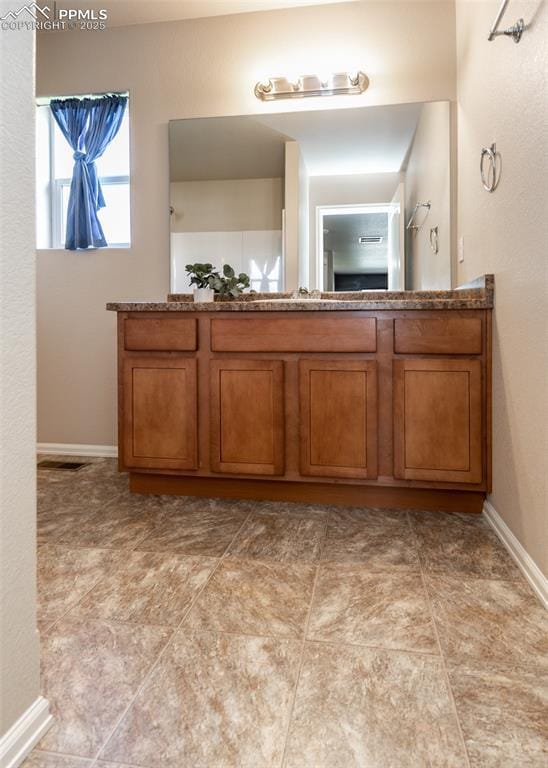 bathroom featuring baseboards