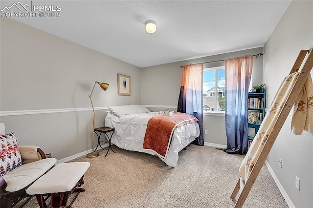 carpeted bedroom with baseboards