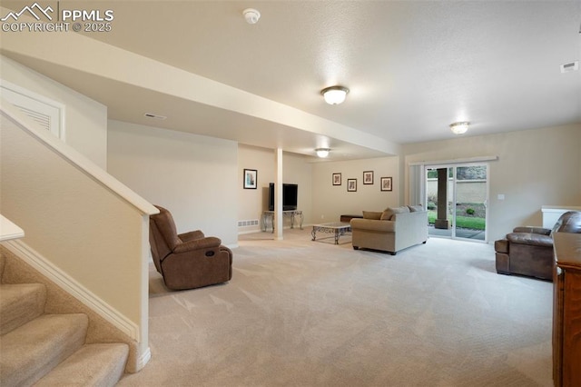 2532 Sierra Oak Dr, Colorado Springs, CO 80919 - living area featuring light colored carpet, visible vents, and stairway