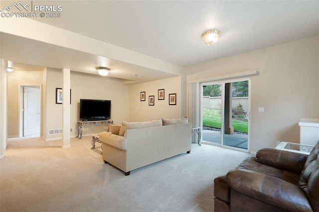 2532 Sierra Oak Dr, Colorado Springs, CO 80919 - living room with visible vents, baseboards, and light carpet