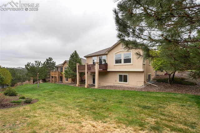 2532 Sierra Oak Dr, Colorado Springs, CO 80919 - back of house with stucco siding, a yard, and a deck