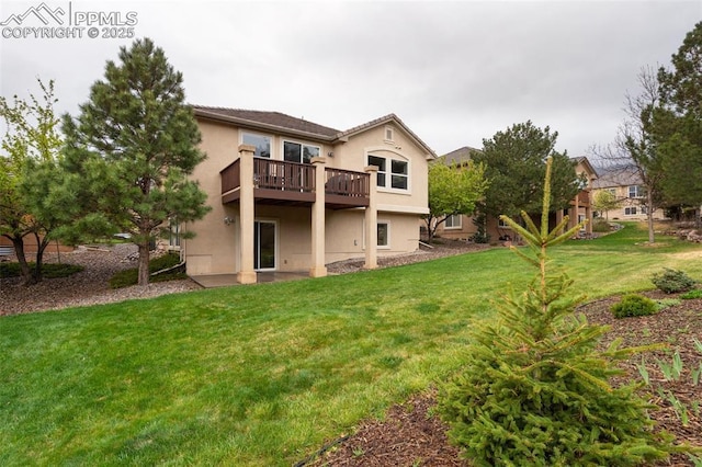 2532 Sierra Oak Dr, Colorado Springs, CO 80919 - rear view of house featuring a lawn, stucco siding, and a deck
