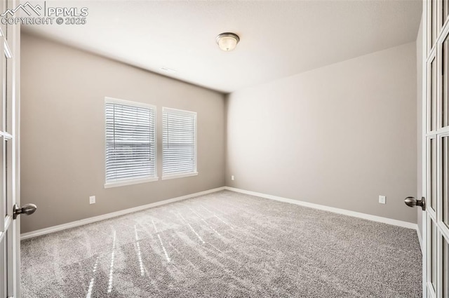 8094 Misty Moon Dr, Colorado Springs, CO 80924 - spare room with baseboards and carpet