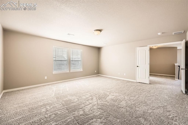 8094 Misty Moon Dr, Colorado Springs, CO 80924 - carpeted empty room with a textured ceiling, visible vents, and baseboards