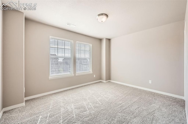 8094 Misty Moon Dr, Colorado Springs, CO 80924 - unfurnished room with carpet flooring, baseboards, and visible vents
