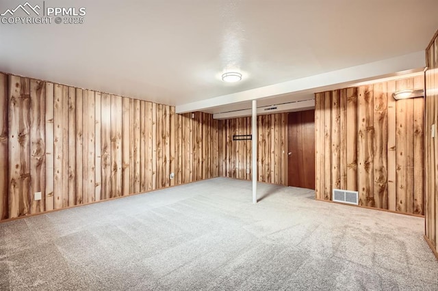 finished basement with carpet floors and visible vents