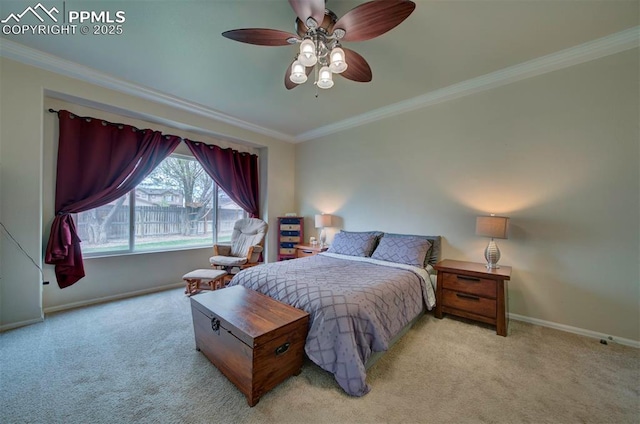 carpeted bedroom with baseboards, ornamental molding, and ceiling fan
