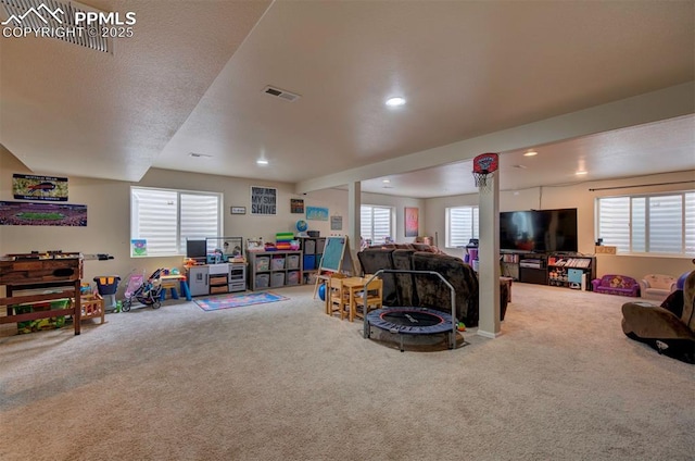 recreation room featuring visible vents, recessed lighting, and carpet
