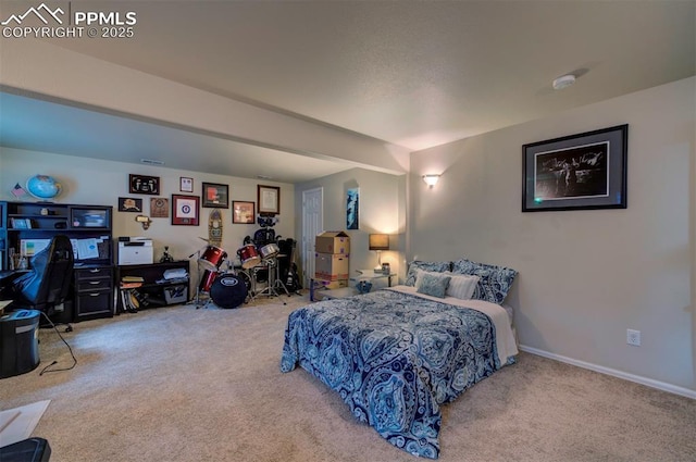 carpeted bedroom with baseboards