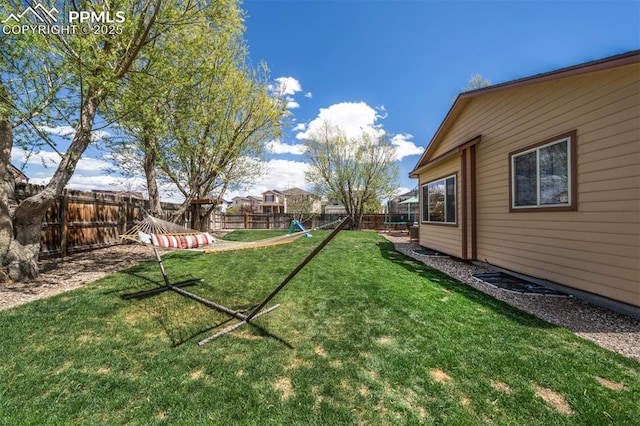 view of yard with a fenced backyard