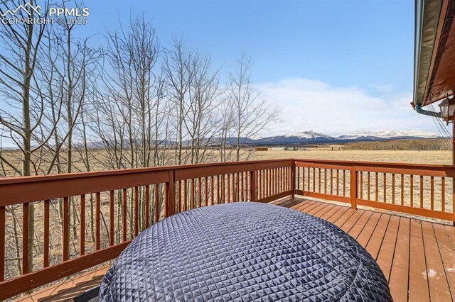 119 Bristlecone Ln, Fairplay, CO 80440 - wooden terrace with a mountain view and outdoor dining space