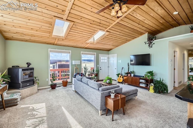 119 Bristlecone Ln, Fairplay, CO 80440 - carpeted living area featuring baseboards, ceiling fan, wood ceiling, and lofted ceiling with skylight