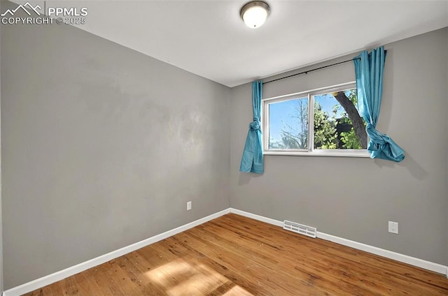 806 N Chelton Rd, Colorado Springs, CO 80909 - empty room with wood finished floors and baseboards