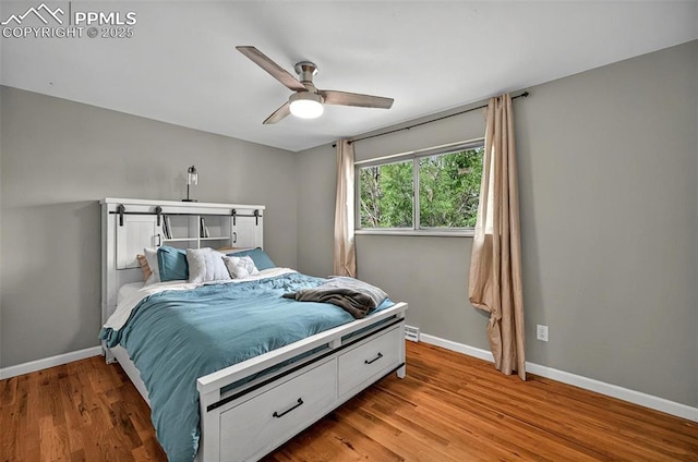 806 N Chelton Rd, Colorado Springs, CO 80909 - bedroom featuring light wood-style flooring, baseboards, and ceiling fan