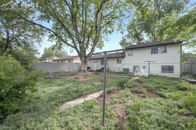 806 N Chelton Rd, Colorado Springs, CO 80909 - back of property featuring fence and central AC