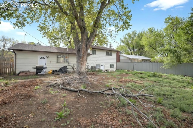 806 N Chelton Rd, Colorado Springs, CO 80909 - rear view of house featuring fence